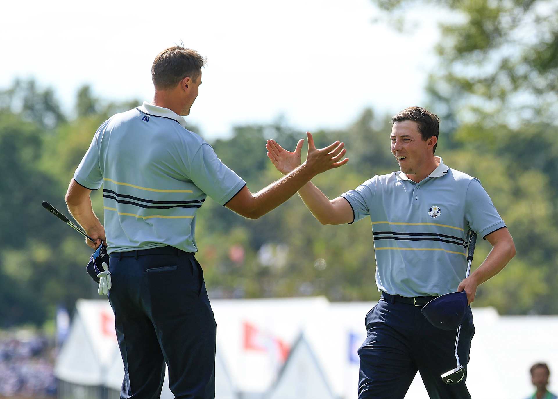 FARMINGDALE, NEW YORK - SEPTEMBER 26: Ludvig Aberg of Sweden and Matt Fitzpatrick of England and The European Team celebrate winning their match on the 15th green by 5&3 agianst Scottie Scheffler and Russell Henley during the Friday morning foursomes matches of the 2025 Ryder Cup at Black Course at Bethpage State Park Golf Course on September 26, 2025 in Farmingdale, New York. (Photo by David Cannon/Getty Images)