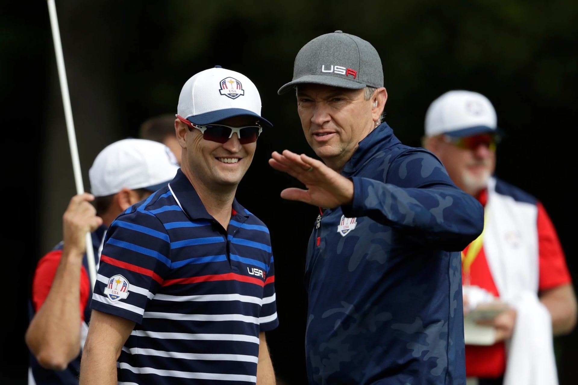CHASKA, MN - SEPTEMBER 29: Captain Davis Love III of the United States speaks to Zach Johnson during practice prior to the 2016 Ryder Cup at Hazeltine National Golf Club on September 29, 2016 in Chaska, Minnesota.  (Photo by Jamie Squire/Getty Images)