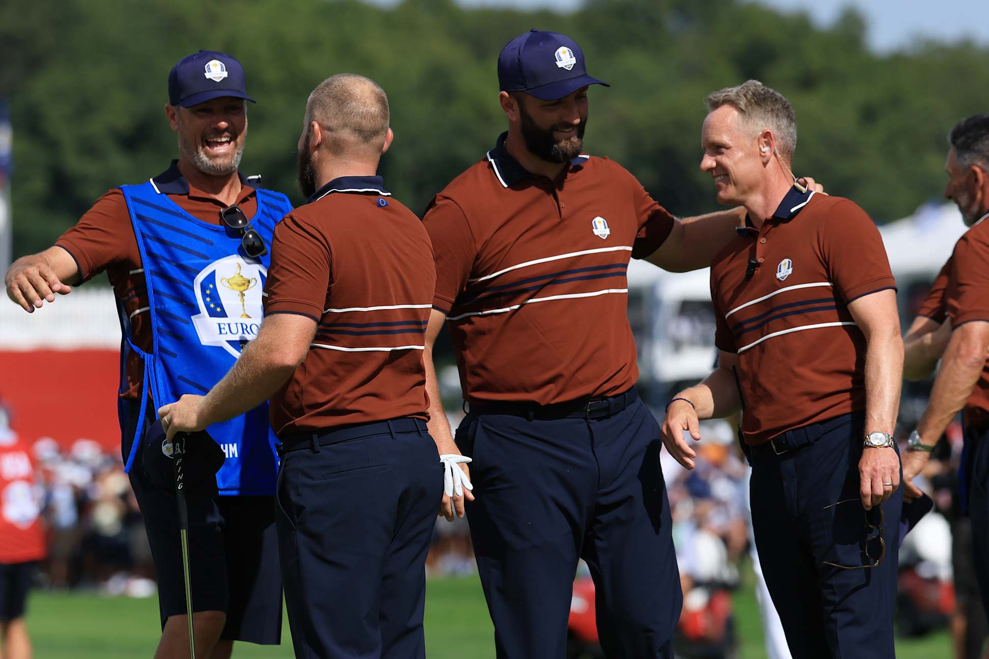 FARMINGDALE, NEW YORK - SEPTEMBER 27:  Team Europe Captain Luke Donald reacts with Jon Rahm & Tyrrell Hatton of Europe after winning their match during the Saturday morning foursomes matches of the 2025 Ryder Cup at Black Course at Bethpage State Park Golf Course on September 27, 2025 in Farmingdale, New York. (Photo by David Cannon/Getty Images)