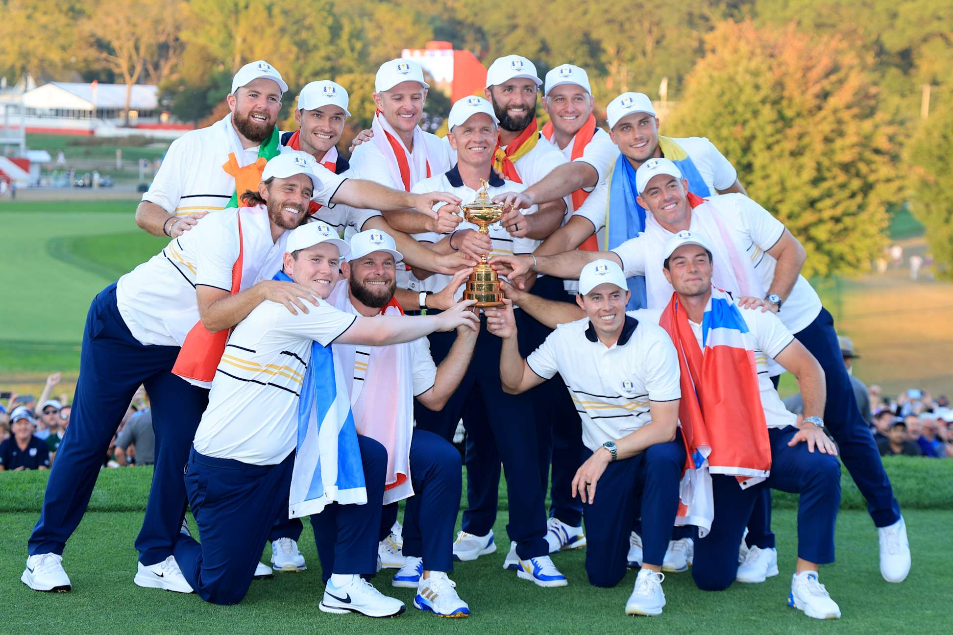 FARMINGDALE, NEW YORK - SEPTEMBER 28: Europe Captain Luke Donald, Shane Lowry, Rasmus Hojgaard, Justin Rose, Jon Rahm, Sepp Straka, Ludvig Aberg, Rory McIlroy, Viktor Hovland, Matt Fitzpatrick, Tommy Fleetwood, Robert MacIntyre and Tyrrell Hatton of Team Europe hold the Ryder Cup trophy after their 15-13  victory during the trophy presentation ceremony following the Sunday singles matches of the 2025 Ryder Cup at Black Course at Bethpage State Park Golf Course on September 28, 2025 in Farmingdale, New York. (Photo by David Cannon/Getty Images)